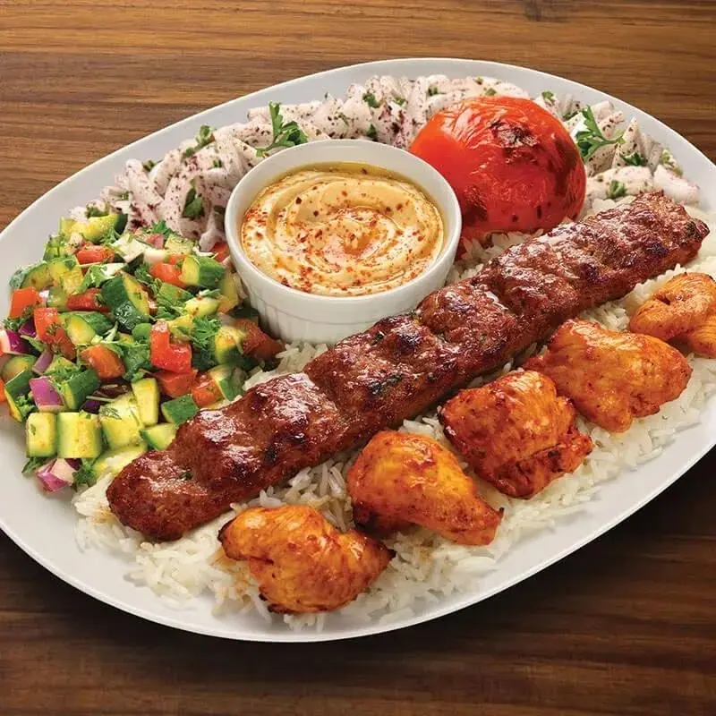 The Adana Special: beef kabob and marinated chicken over basmati rice with hummus, salad and warm pita
