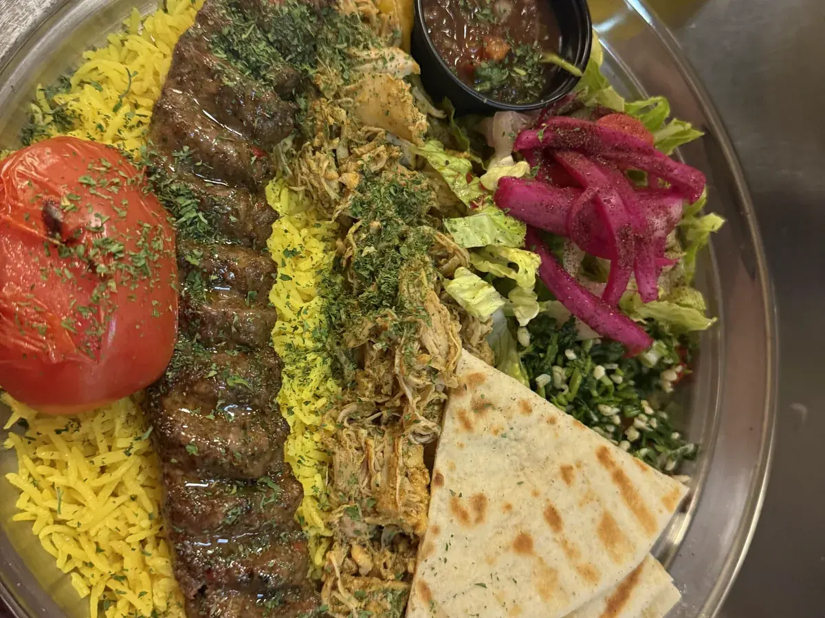 The Adana Special at Kaboblicious: beef kabob and marinated chicken over saffron rice with salad, vinegar onions and warm pita