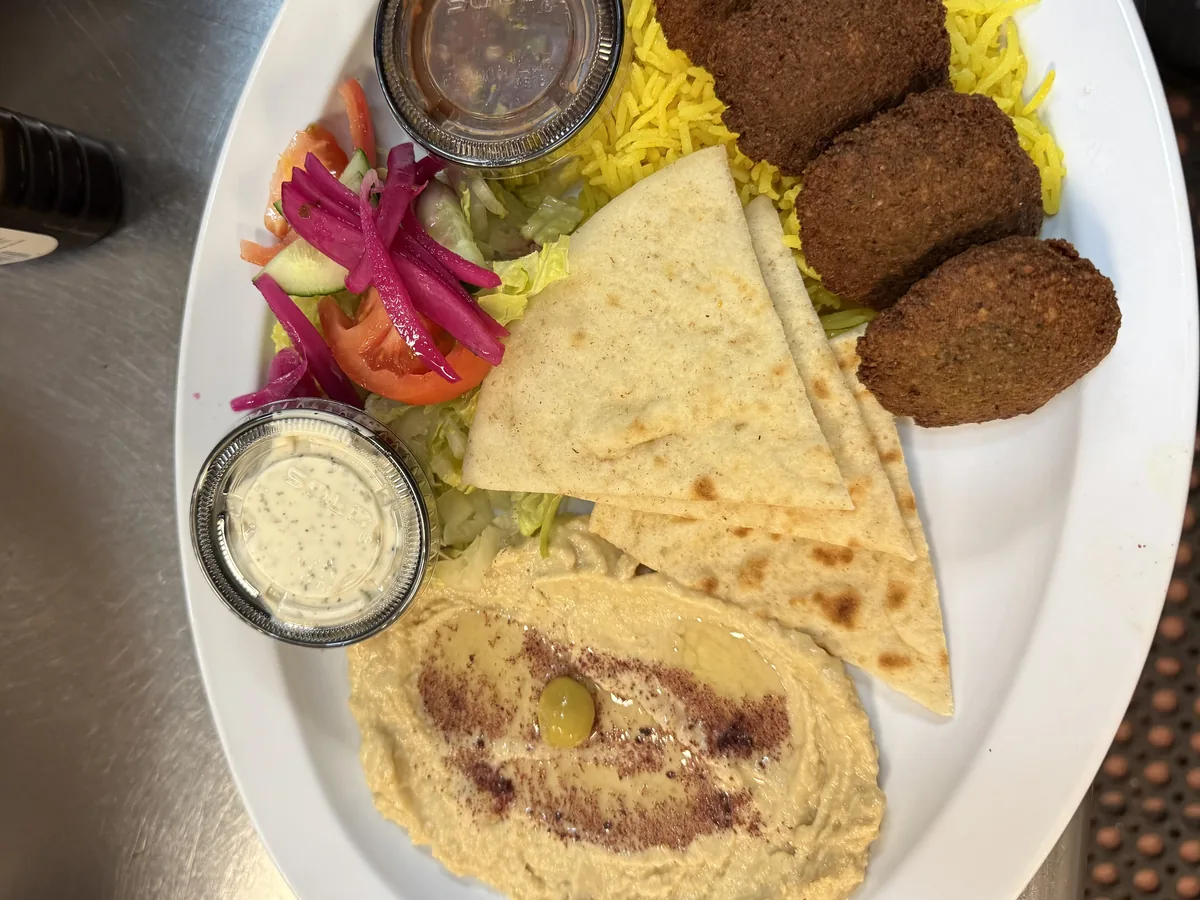 Falafel and hummus platter with saffron rice, warm pita and fresh garden salad at Kaboblicious