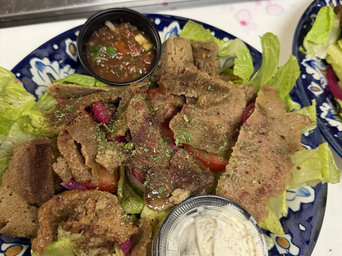 Lamb salad at Kaboblicious: shaved lamb over lettuce, tomato, cucumber and marinated onion with white sauce